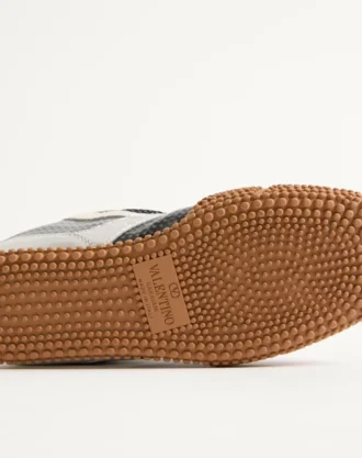 Ténis Amphibia em pele de bezerro emborrachada e napa laminada